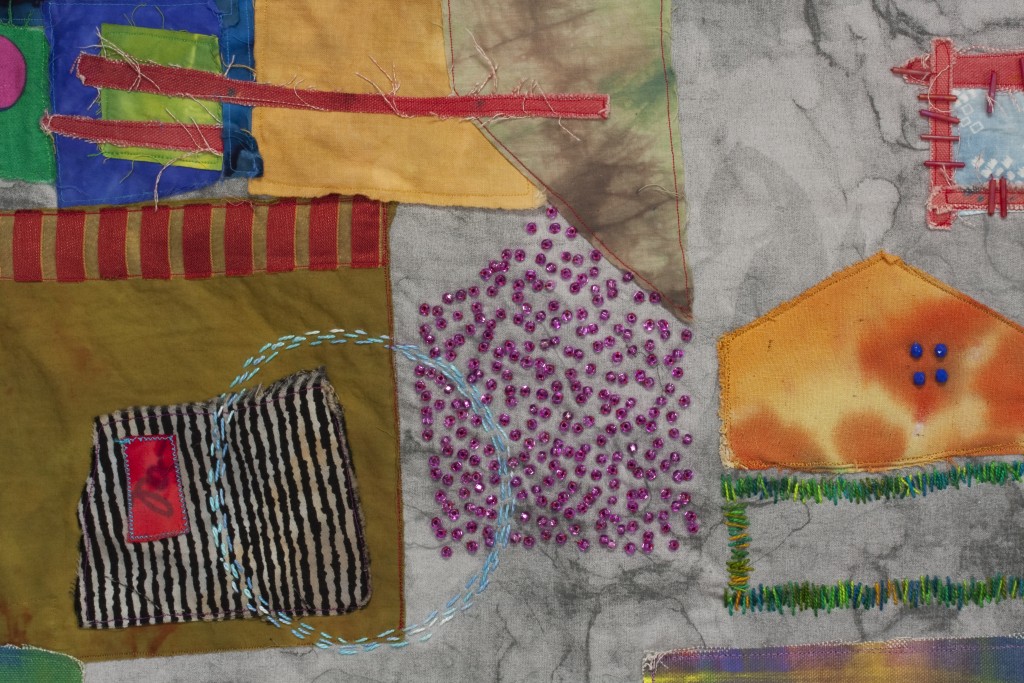 A textile art with colorful beads