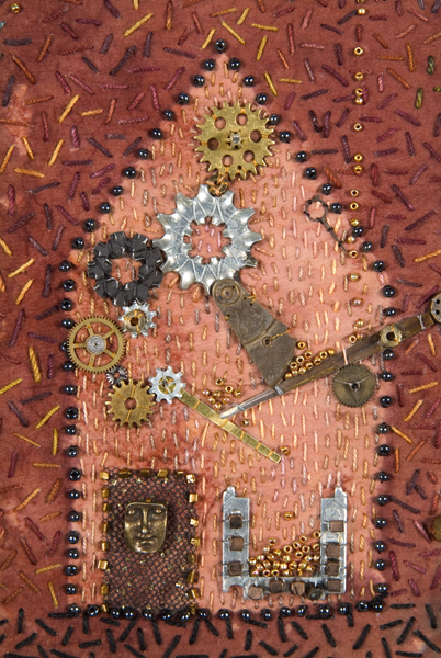 A textile art with an illustration of a house and a door