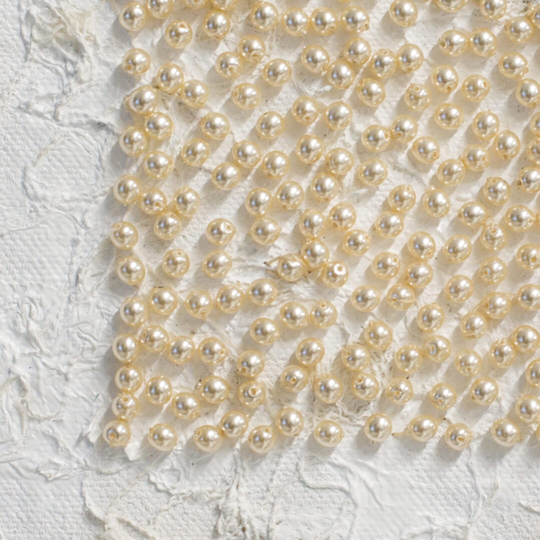 Detailed Look Of Pearls On The Whisper Fabric